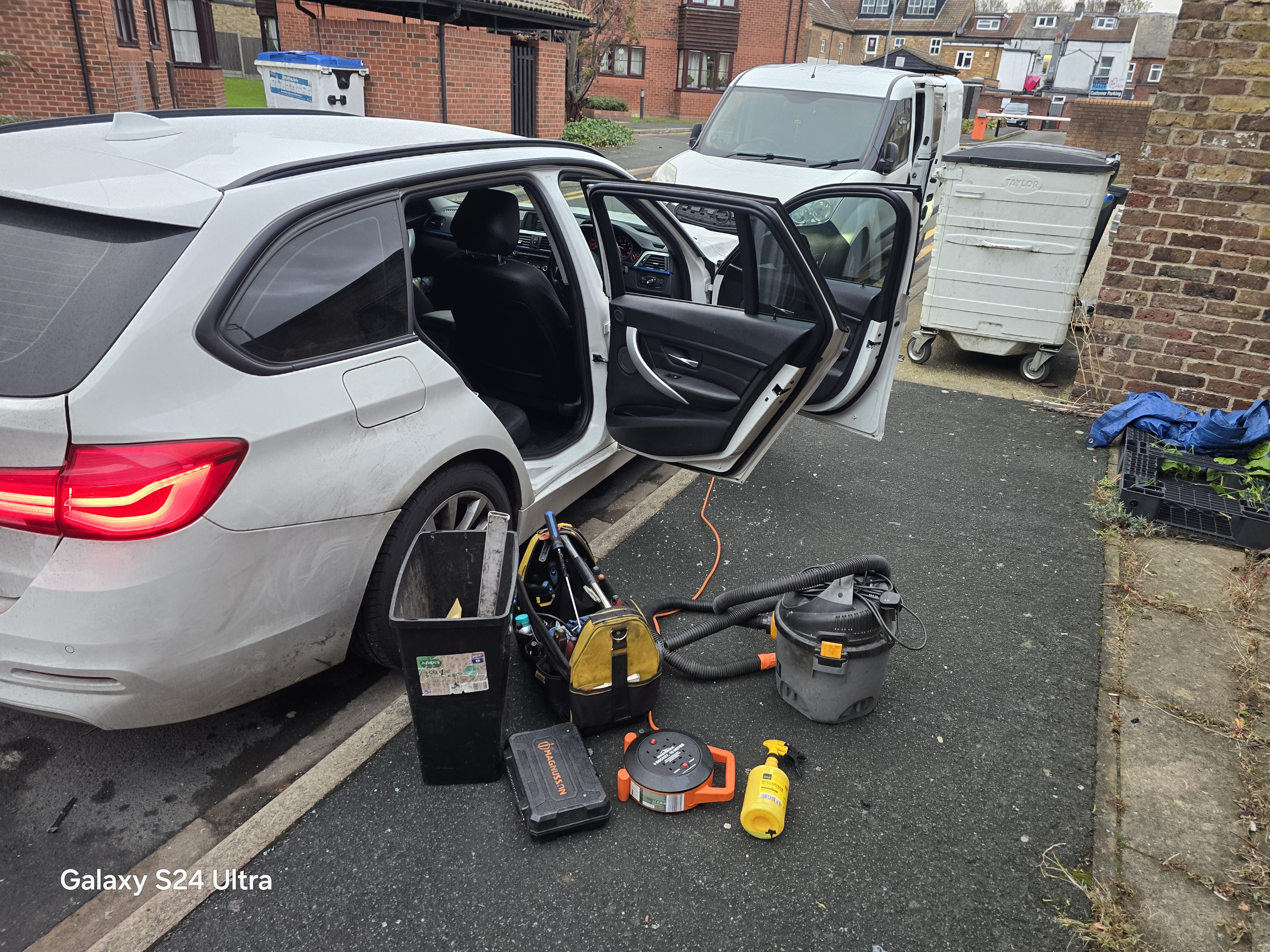 BMW 3 Series side window replacement in Walthamstow E17 — JJ Windscreens technician with professional tools on site