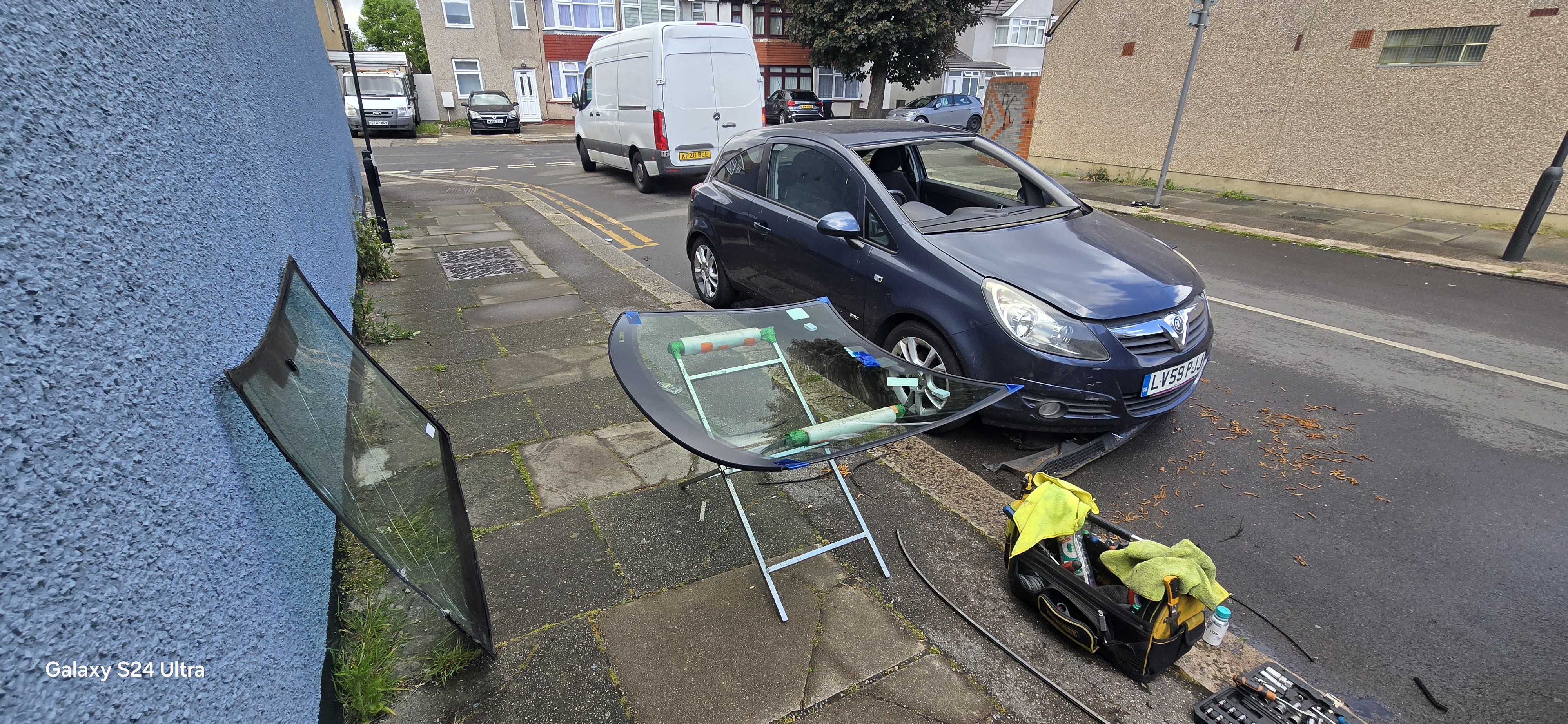 Vauxhall Corsa windscreen replacement on residential street — mobile fitting Romford