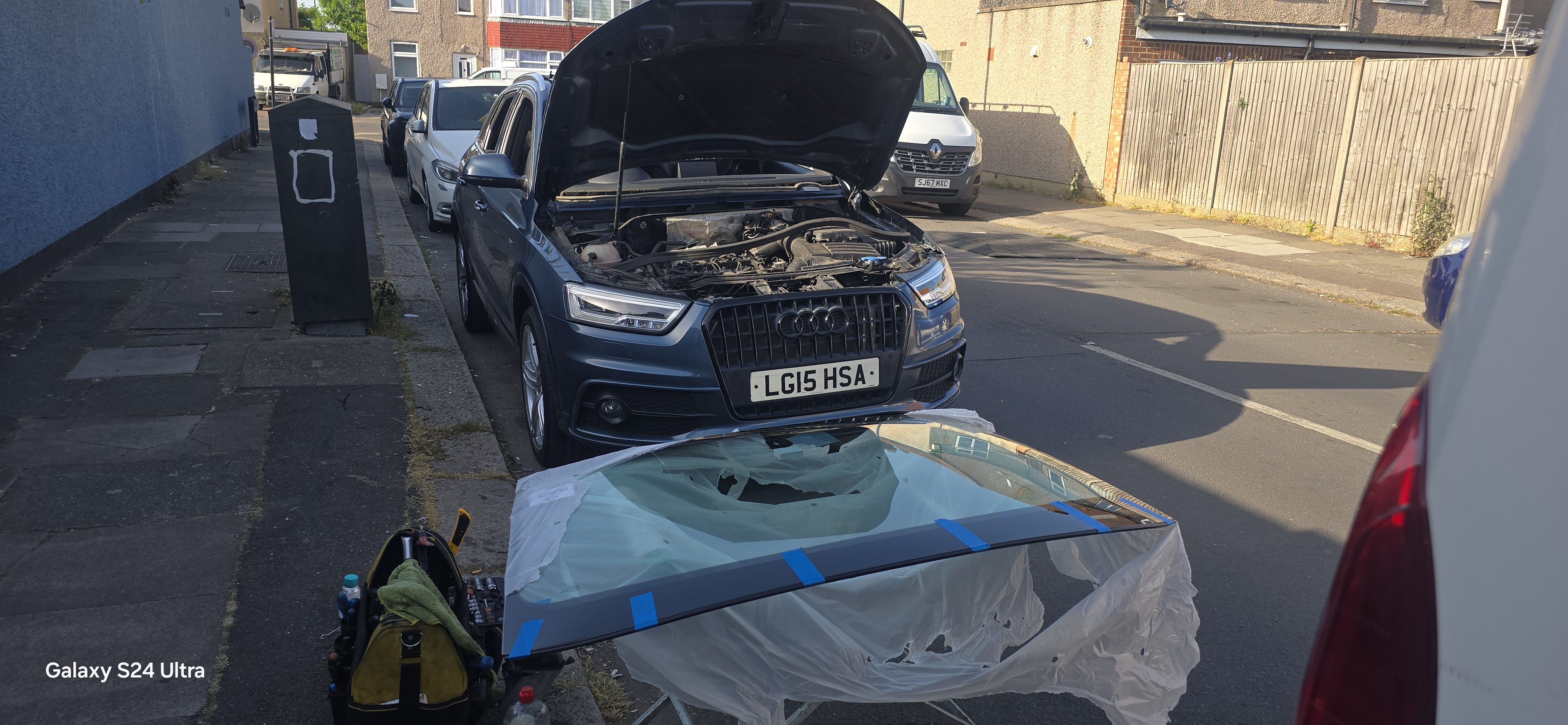 Audi Q3 windscreen on stand ready for fitting — JJ Windscreens mobile service